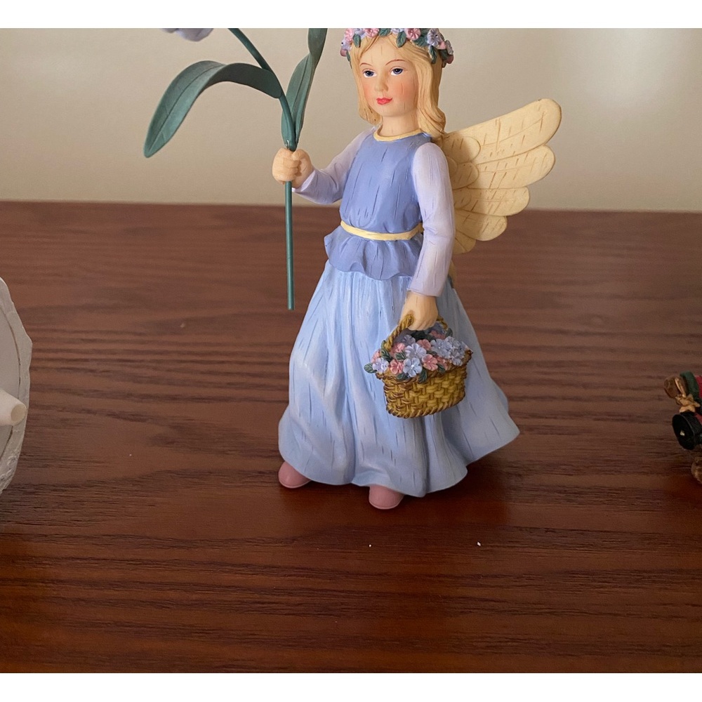 EUC Forget me not wildflower angel figurine.